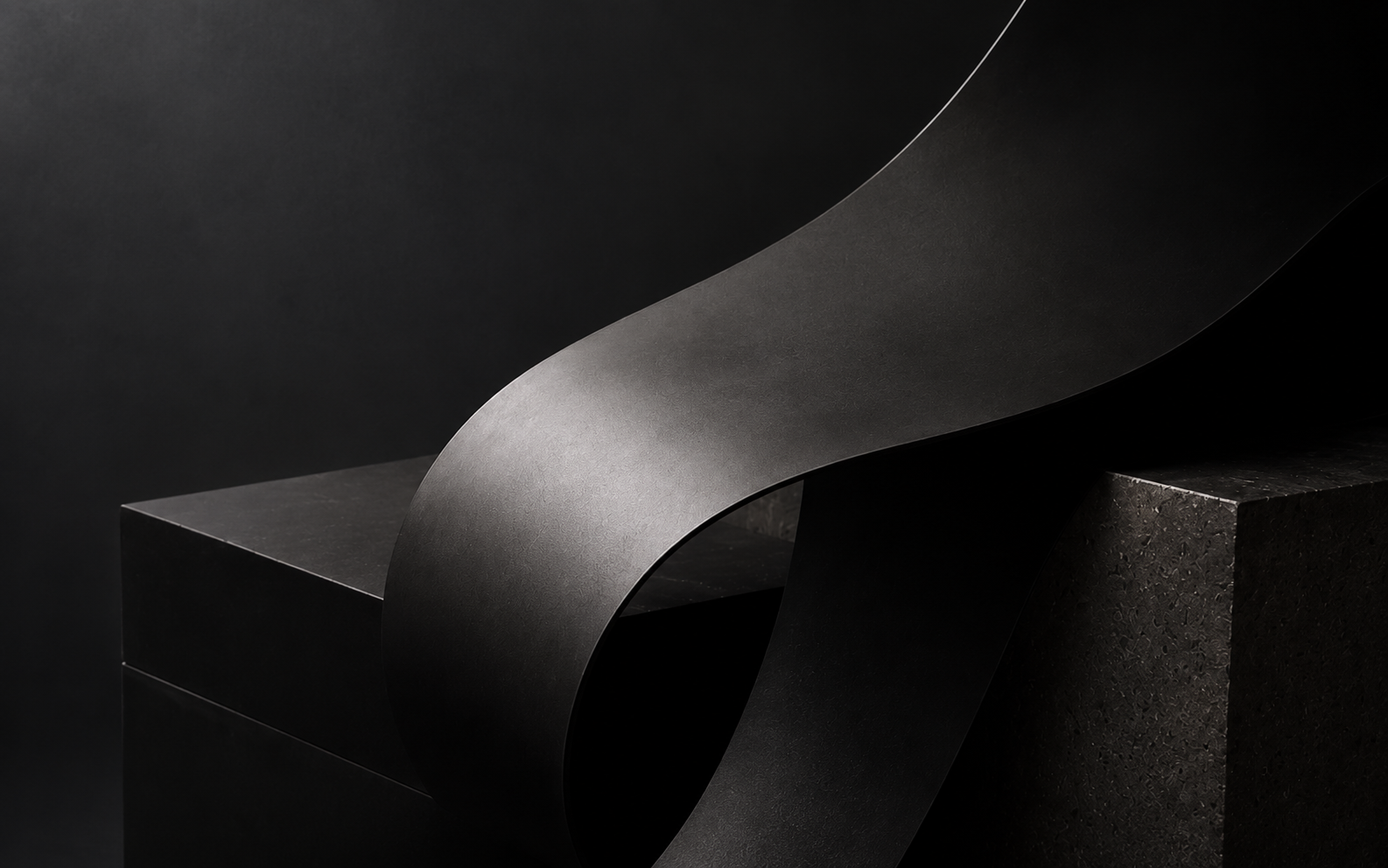 Sculptural black ribbon curving over a monolithic stone plinth